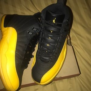 Black/university gold-black Jordan 12s